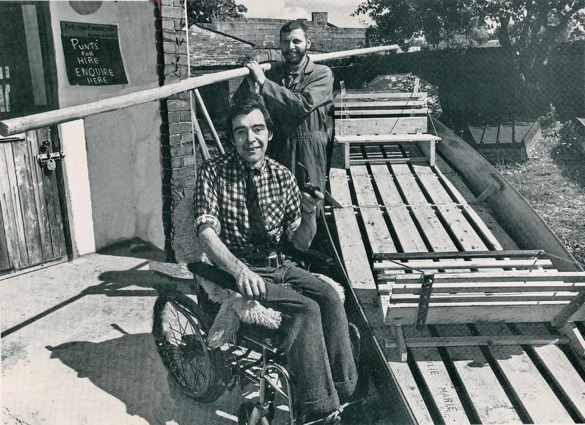 David Vause in a wheelchair and David Shallcross standing next to a punt for hire