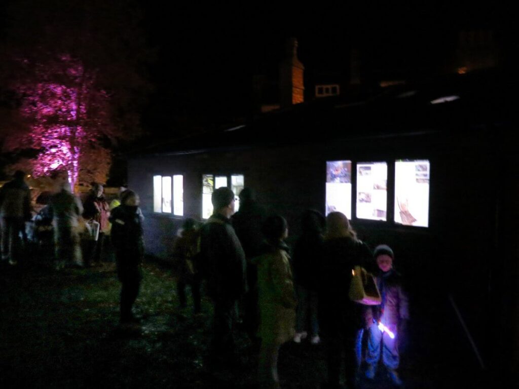 The Triangle at night lit up with coloured lights and lanterns