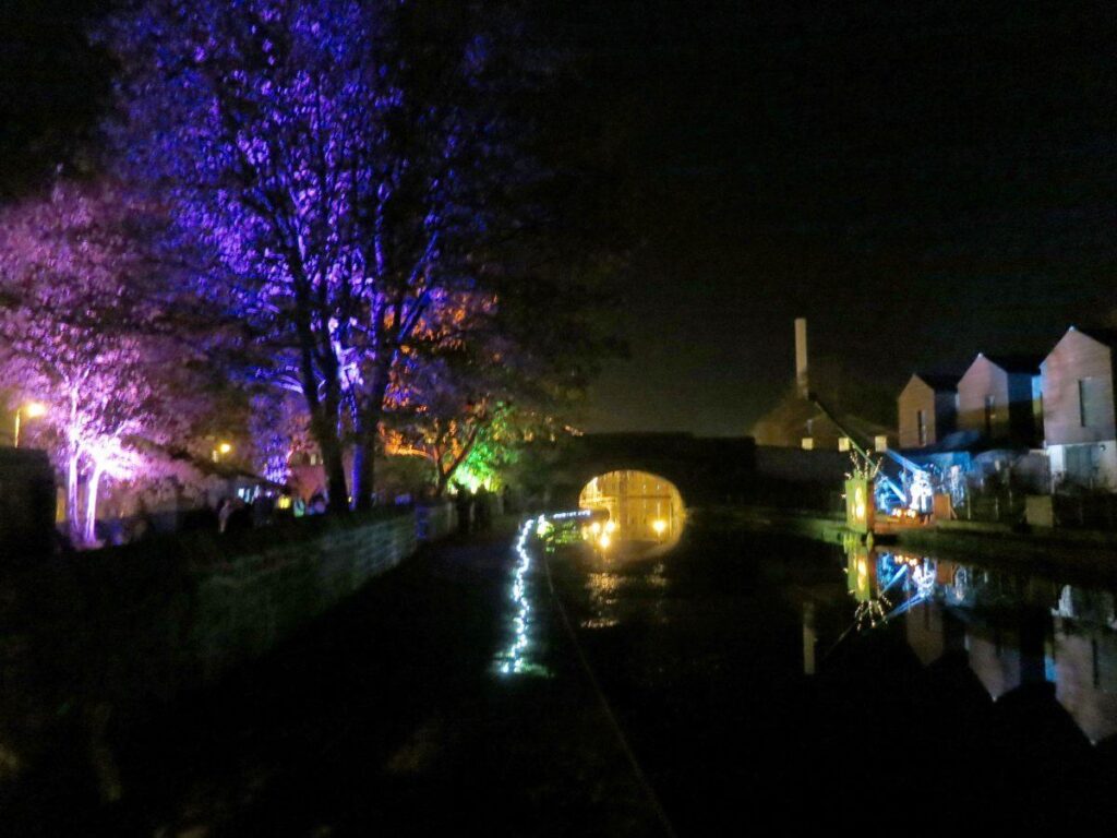 The Triangle at night lit up with coloured lights and lanterns