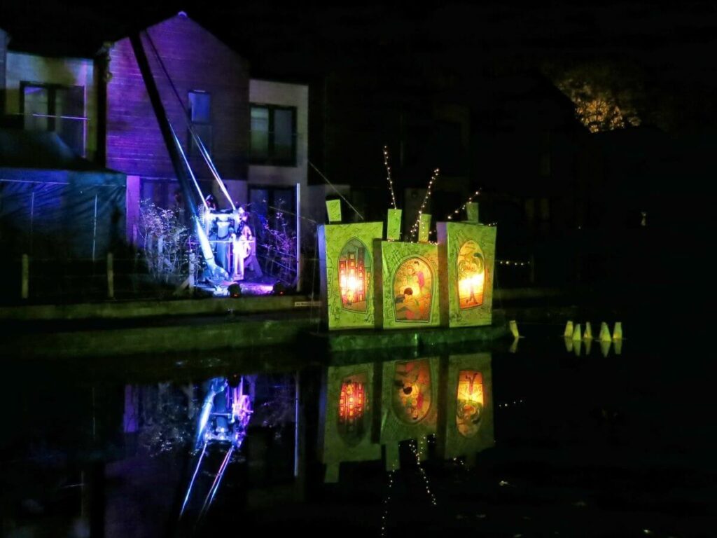 The Triangle at night lit up with coloured lights and lanterns