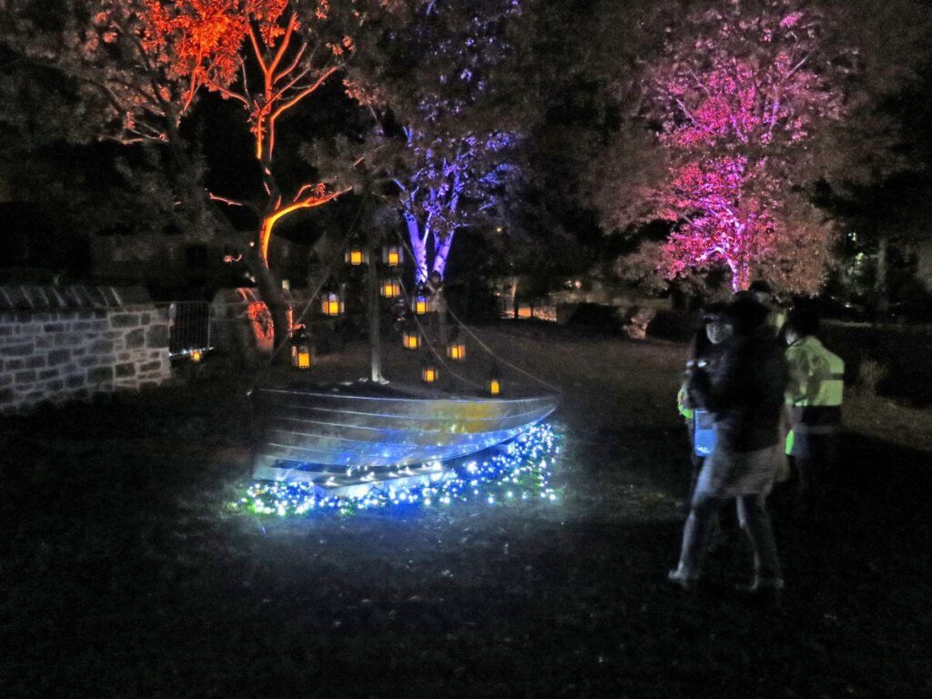 The Triangle at night lit up with coloured lights and lanterns