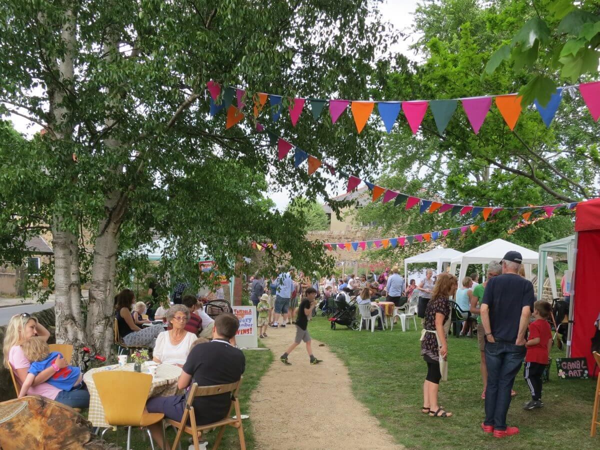 Scene with people attending the Spring Fair at the Triangle