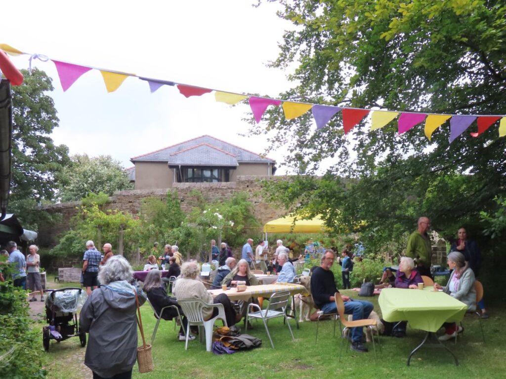 People sitting at tables - Triangle Summer Fair August 2025