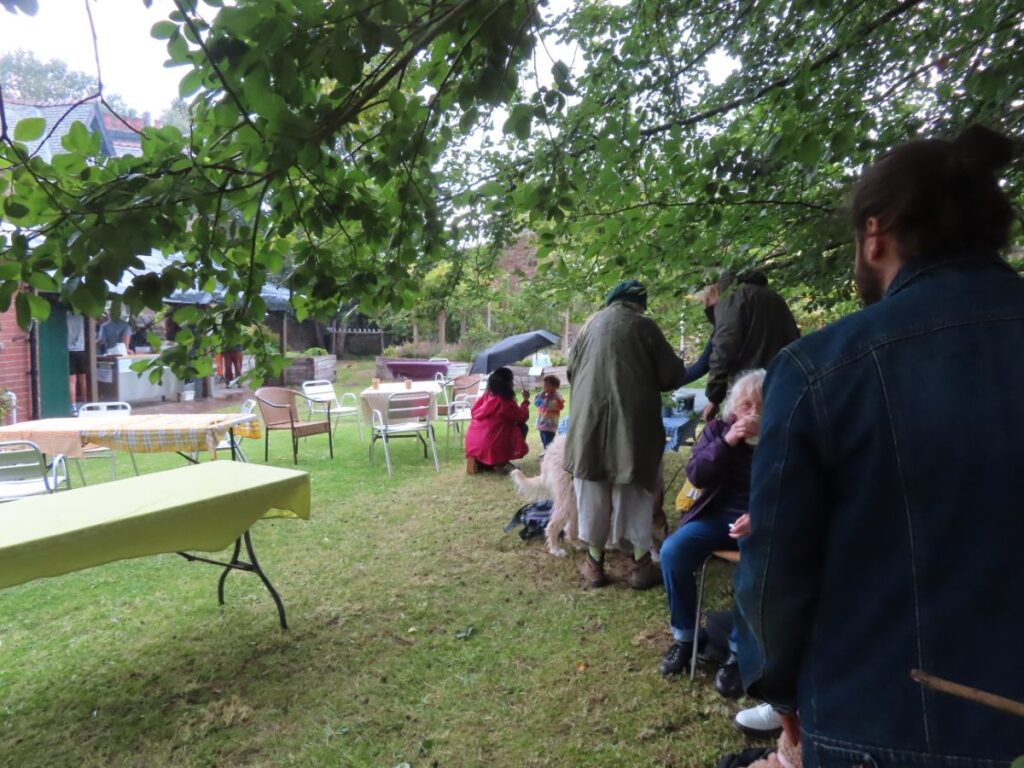 Empty tables and people hiding from rain - Triangle Summer Fair August 2025