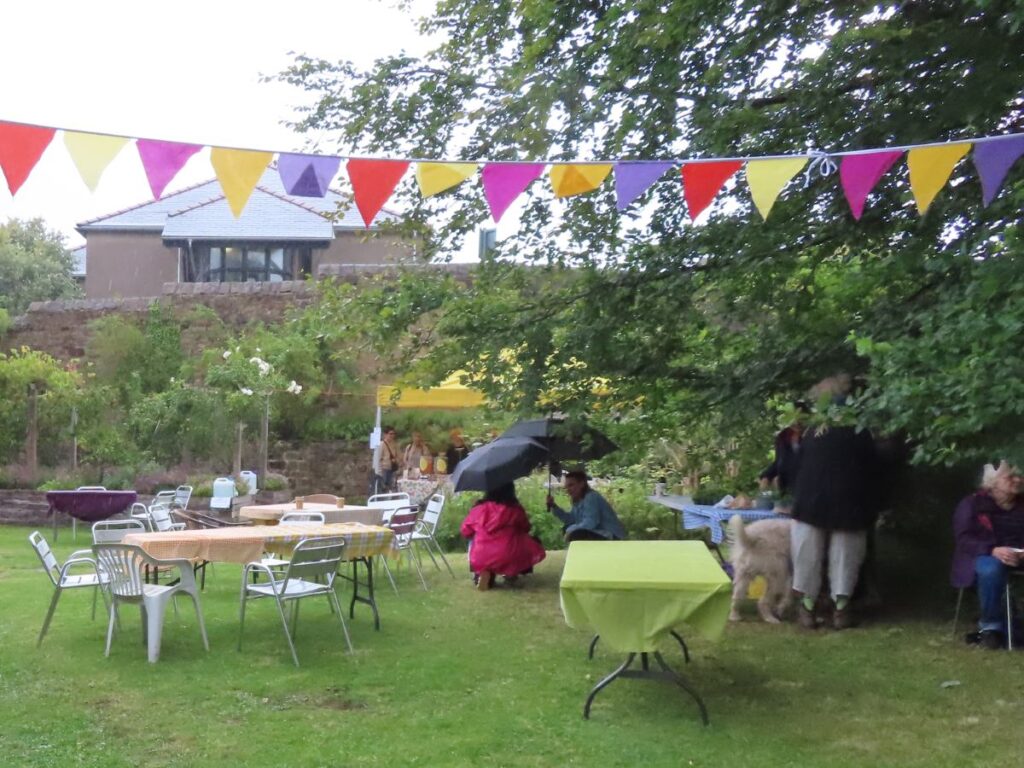 Empty tables and people hiding from rain - Triangle Summer Fair August 2025